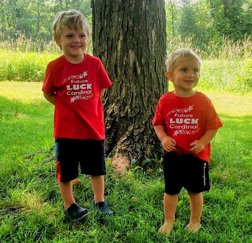 two boys wearing Future Luck Cardinal t-shirts