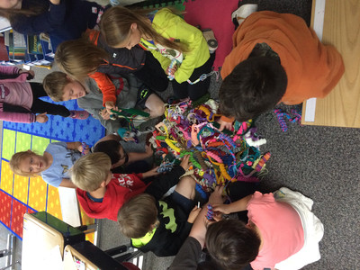Donna Asper shares her talent of making book worms with the students.