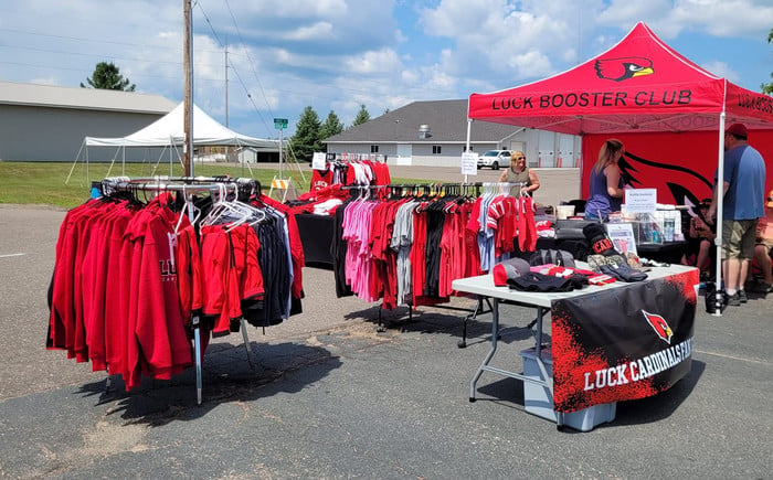 booster club booth set up with clothing