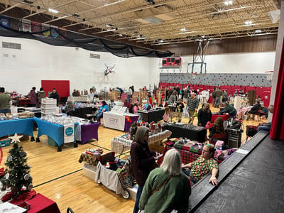vendors set up at craft show in school gym