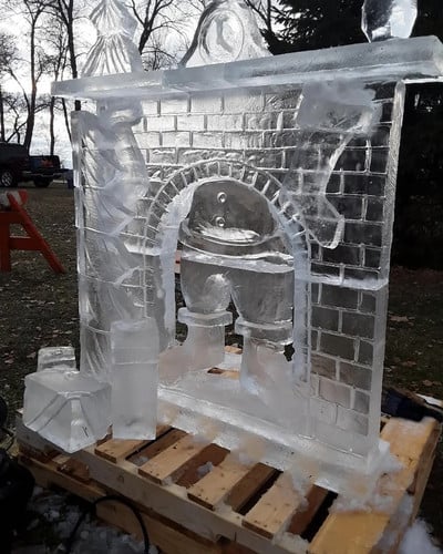 ice sculpture of Santa in a fireplace
